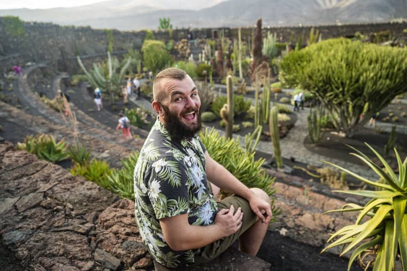 Man sitting in Cactus Garden in Lanzarote