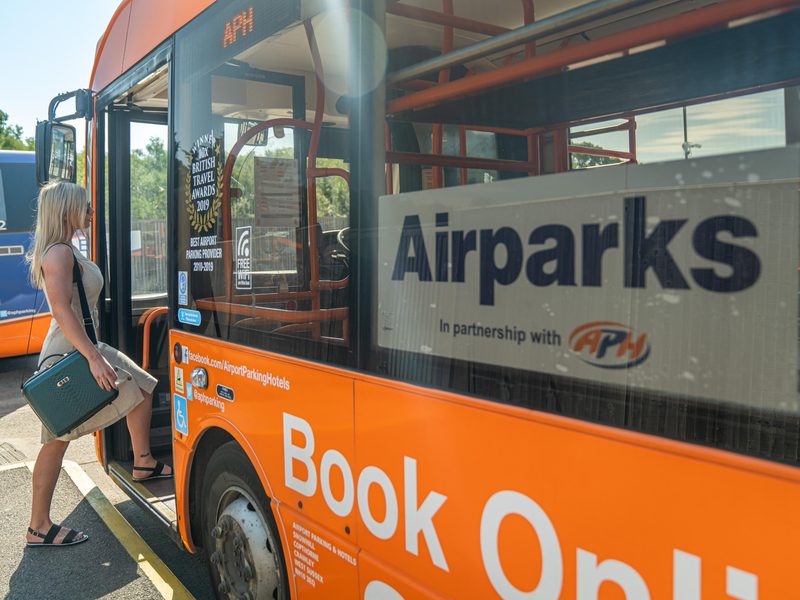 Passenger boarding a shuttle bus from a Gatwick car park
