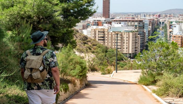 Man with backpack walking in Alicante
