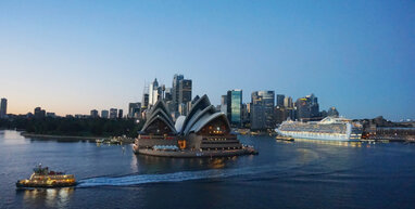 Sydney Opera House with buildings in background.