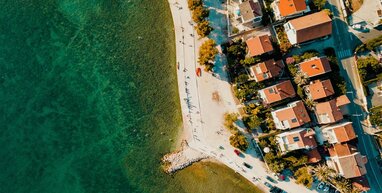 Green sea and buildings in Zadar.