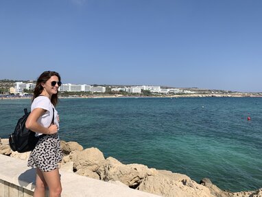 Girl looking out at Paphos sea