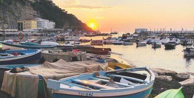 Boats in Sorrento with sunset
