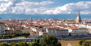 Turin buildings with mountains in background.