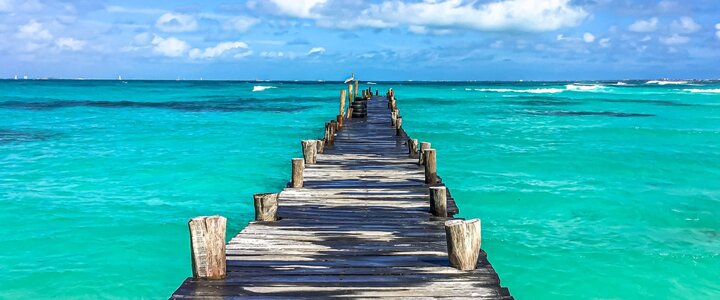 Cancun wooden bridge into sea.