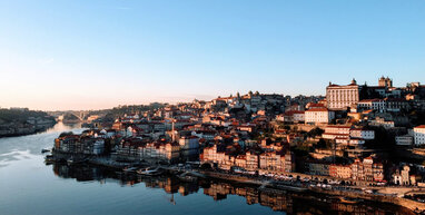 Porto houses along river at sunset.