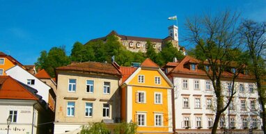 Ljubljana houses with bright blue sky.