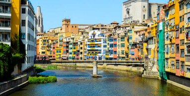 Girona buildings and bridge across water.