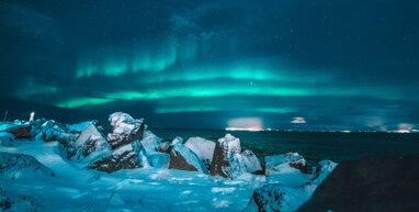 Northen Lights across sea.