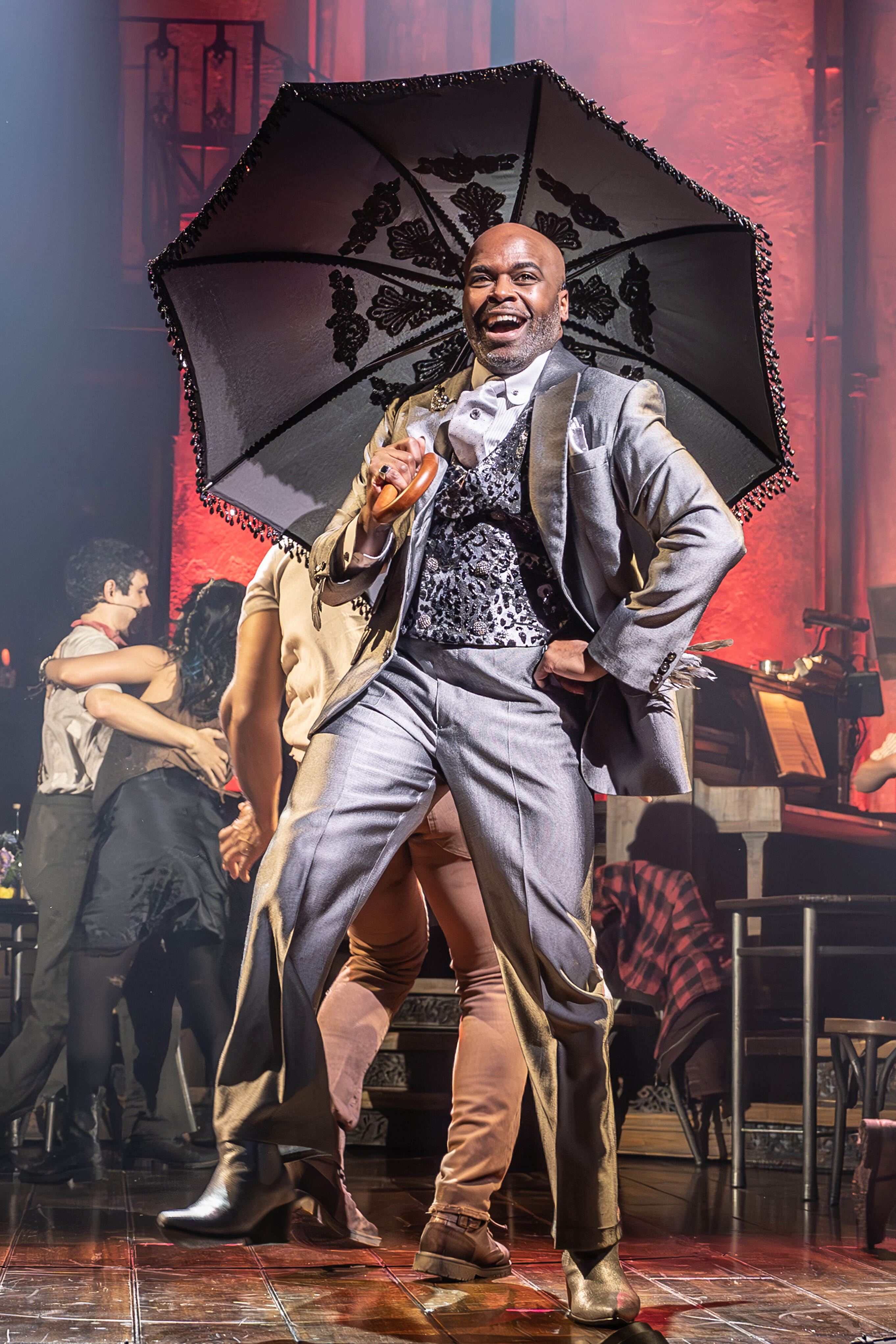 Hadestown cast performing on stage – photo by Marc Brenner