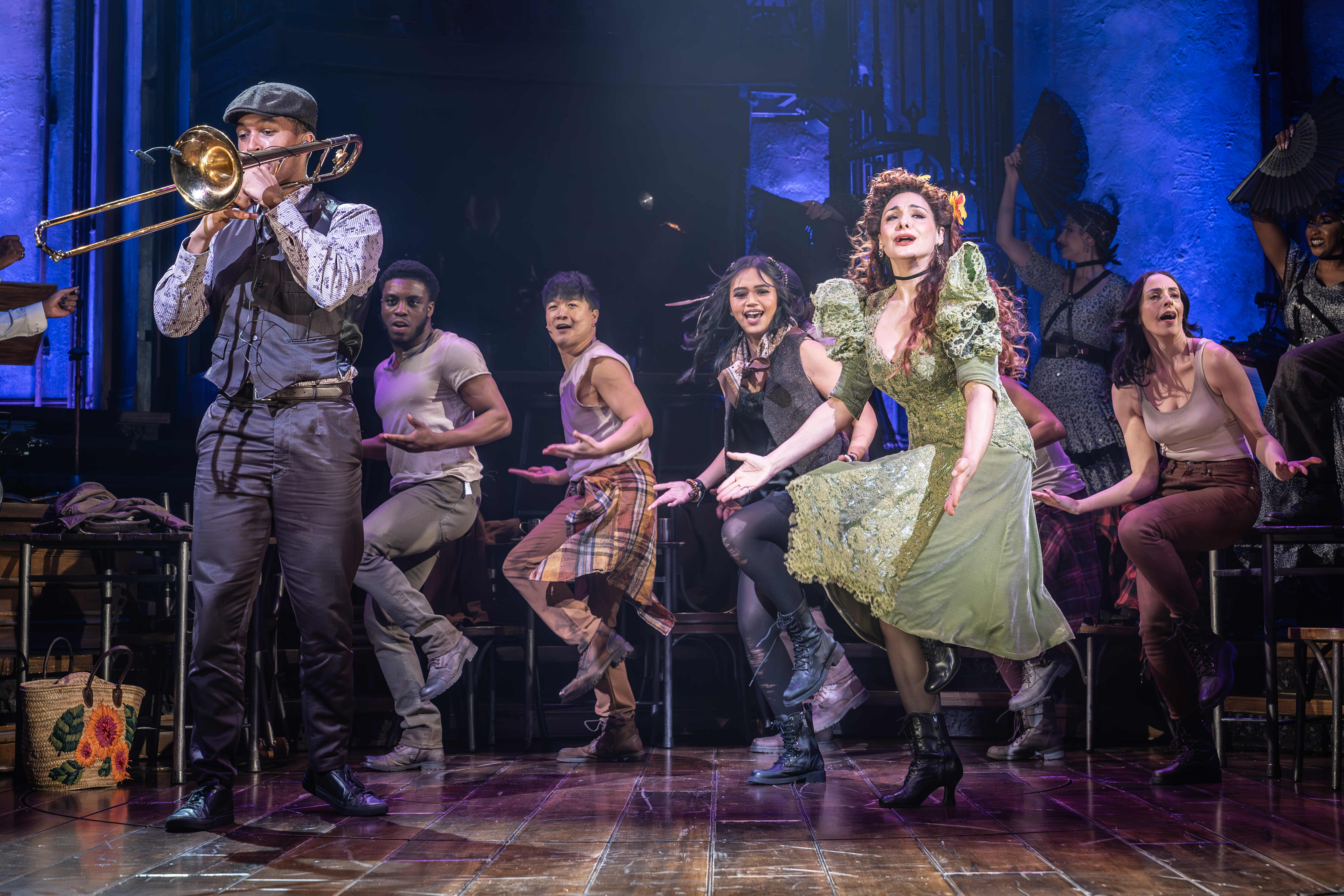 Hadestown actors in motion during a musical scene – photo by Marc Brenner
