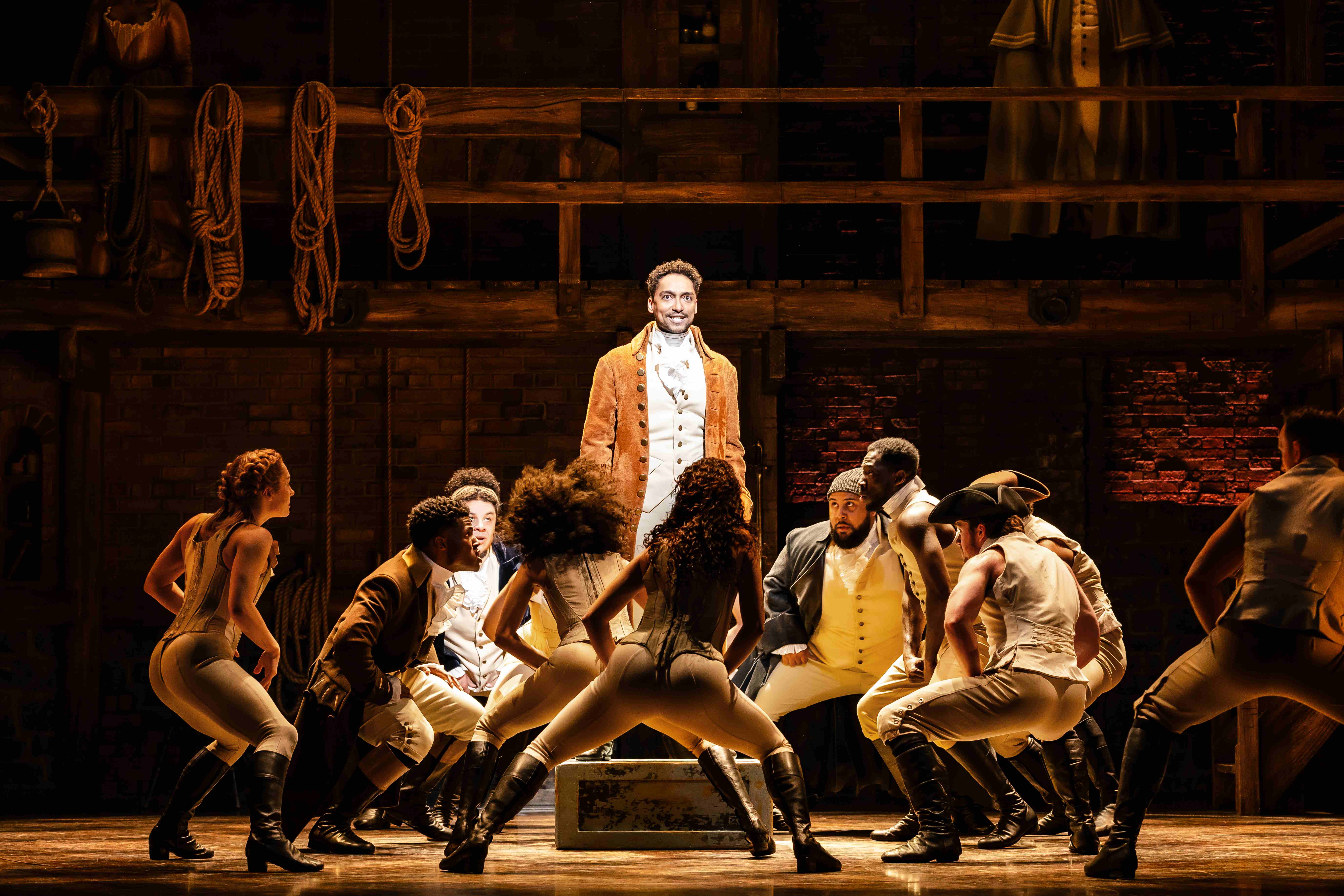 West End Theatre Packages - Vivid production stills from Hamilton The Musical, featuring key scenes and characters on stage.