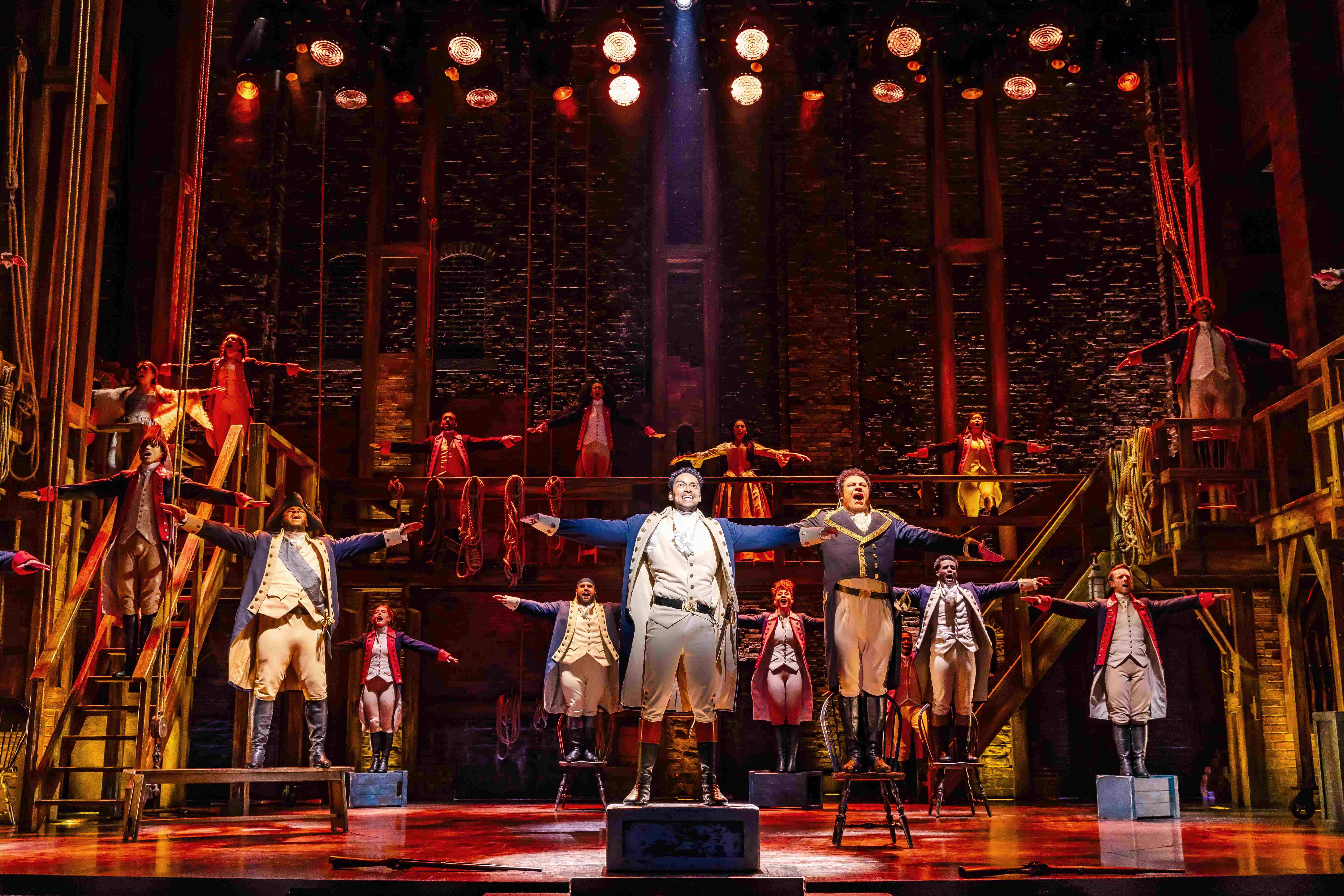 West End Theatre Packages - Vivid production stills from Hamilton The Musical, featuring key scenes and characters on stage.