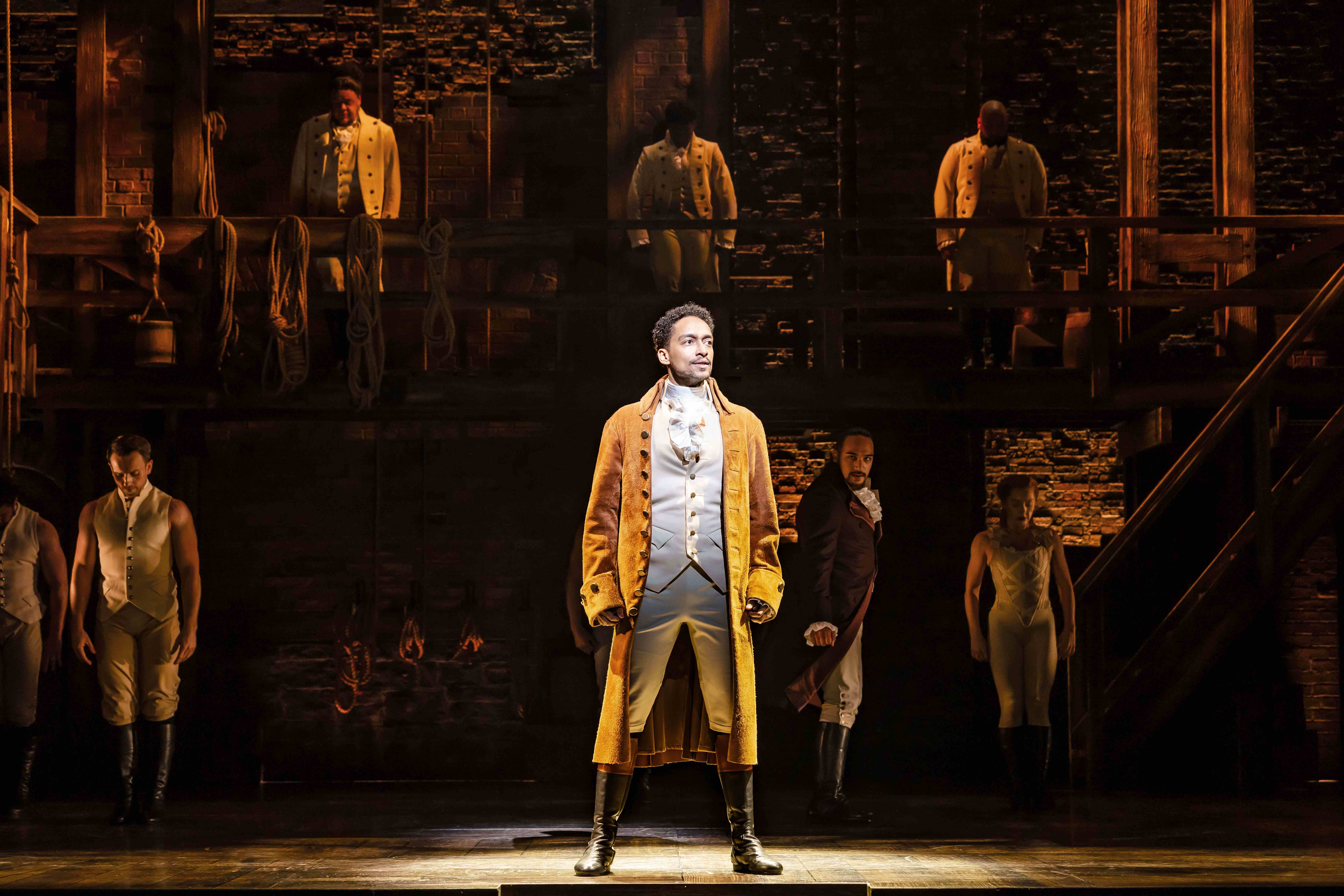 West End Theatre Packages - Vivid production stills from Hamilton The Musical, featuring key scenes and characters on stage.