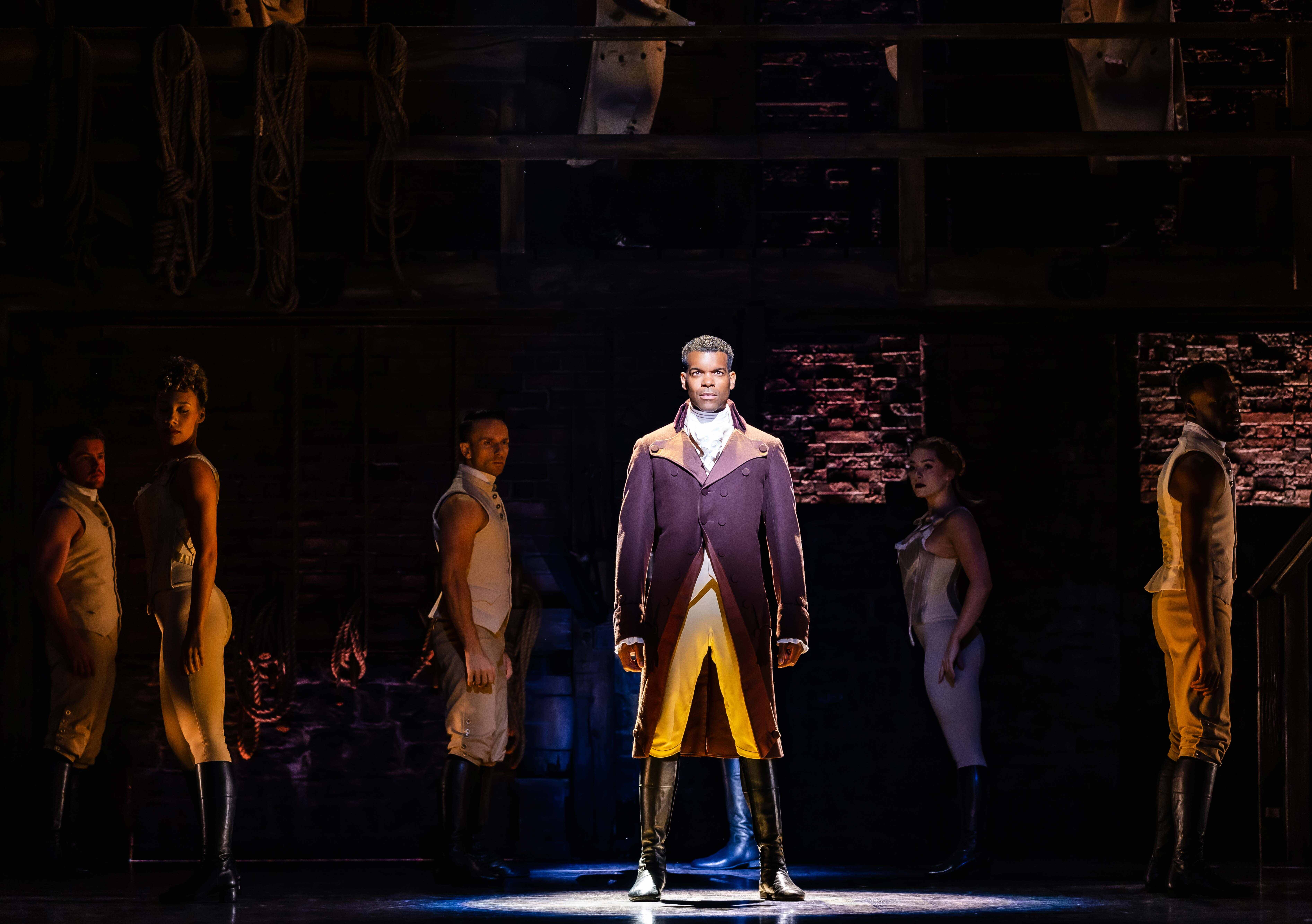 West End Theatre Packages - Vivid production stills from Hamilton The Musical, featuring key scenes and characters on stage.