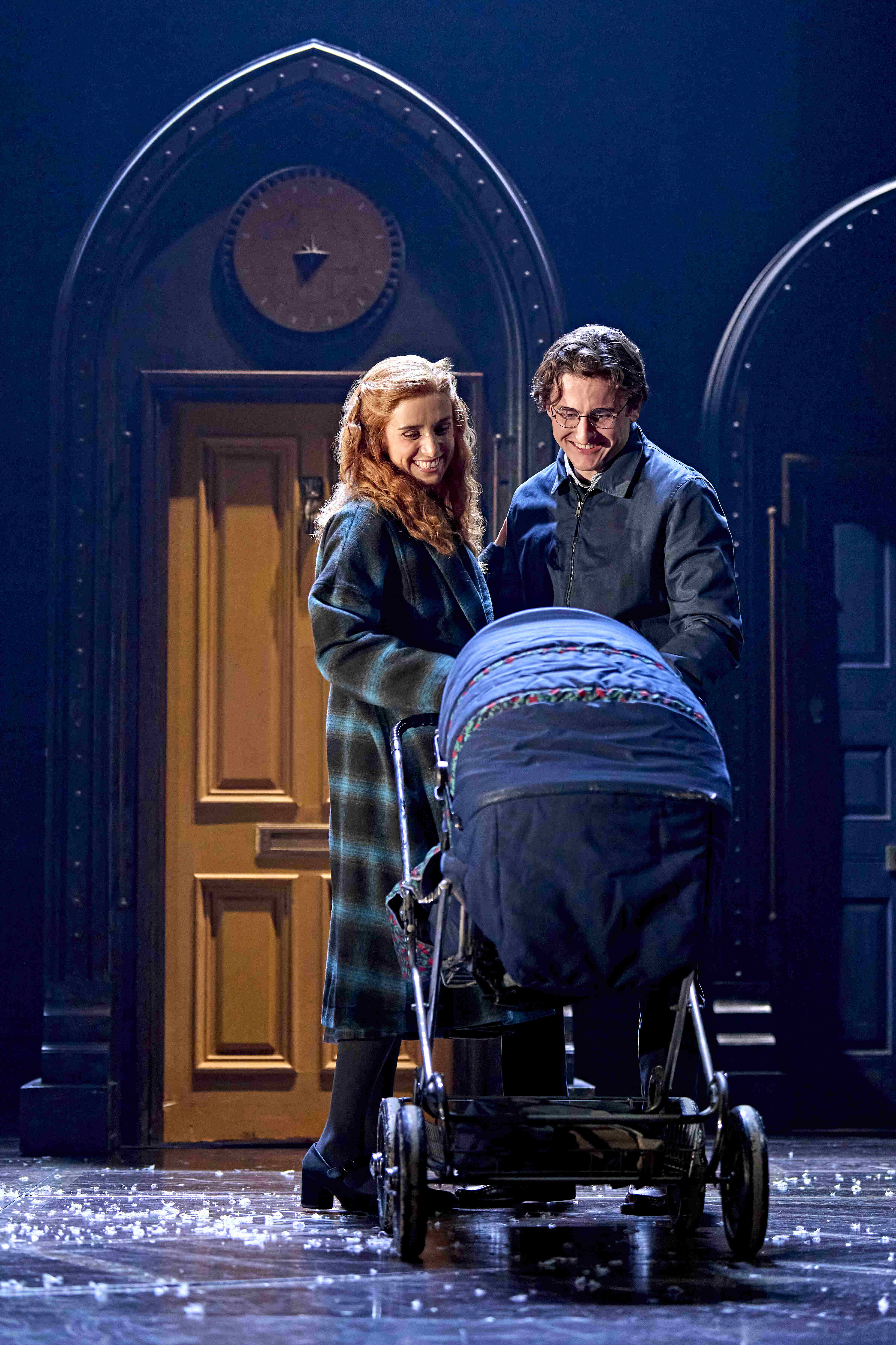 Character standing under a large clock, looking up at a flying hat, from Harry Potter and the Cursed Child.