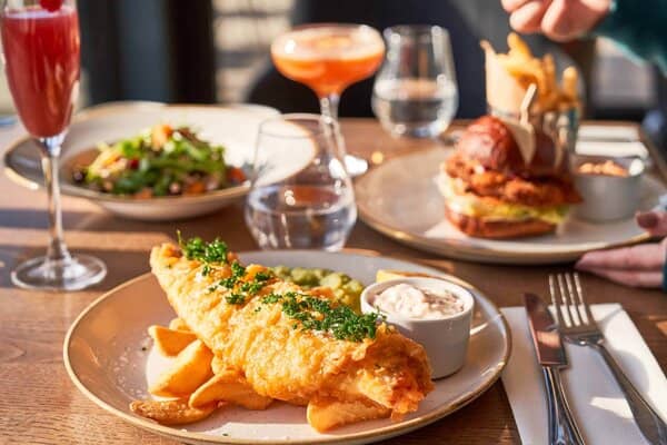 Fish and chips served at a table in an airport hotel