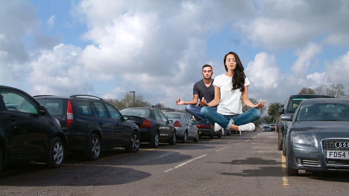Person driving on a snowy forest road, seen from inside a modern car with GPS navigation on screen — winter road trip through scenic countryside.