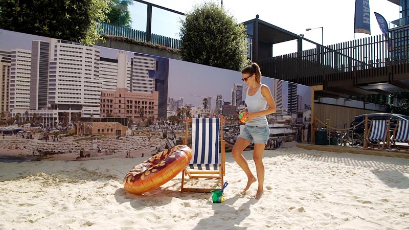 Feet in the sand and deckchair out at JW3 beach London