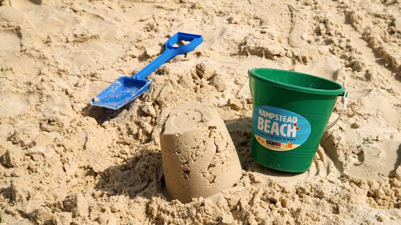 making sandcastles at JW3 beach London