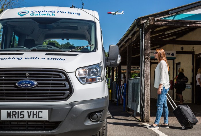 Female passenger boarding a Cophall Parking Park & Ride shuttle bus at Gatwick Airport