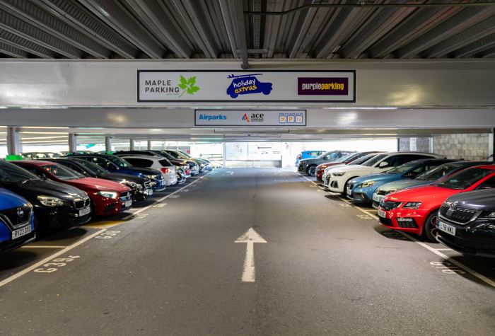 Car park at Holiday Extras Meet & Greet North Gatwick Airport with directional arrows leading to parking area