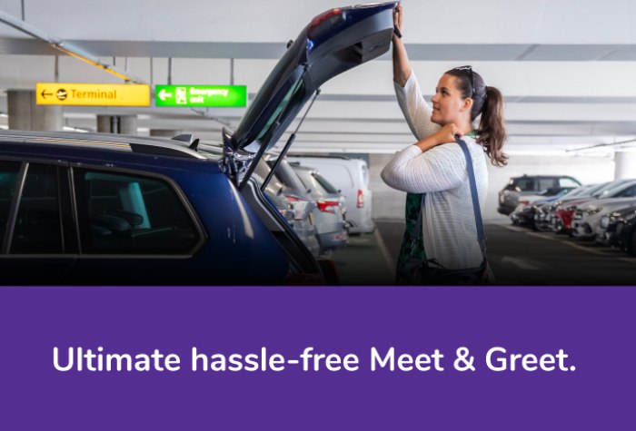 Female customer dropping off her car at Holiday Extras Meet and Greet Heathrow Terminal 2, taking luggage from the open boot with text reading 'Ultimate hassle-free Meet & Greet'