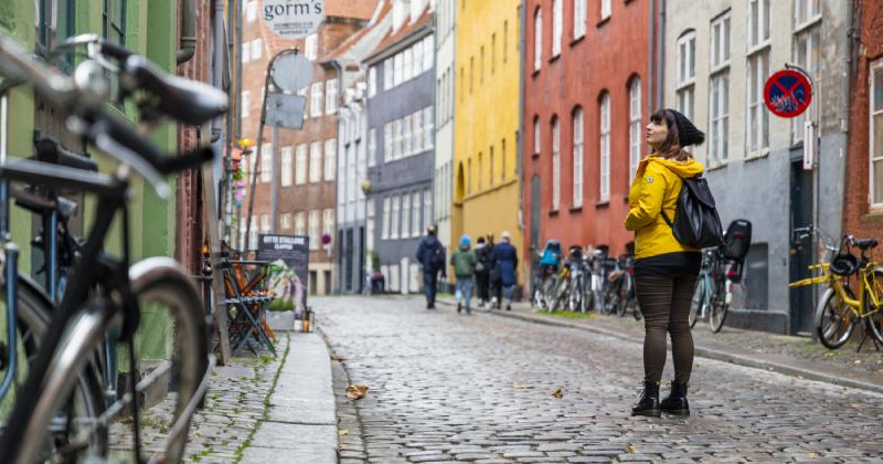 Copenhagen cityscape with a traveller exploring the colourful streets