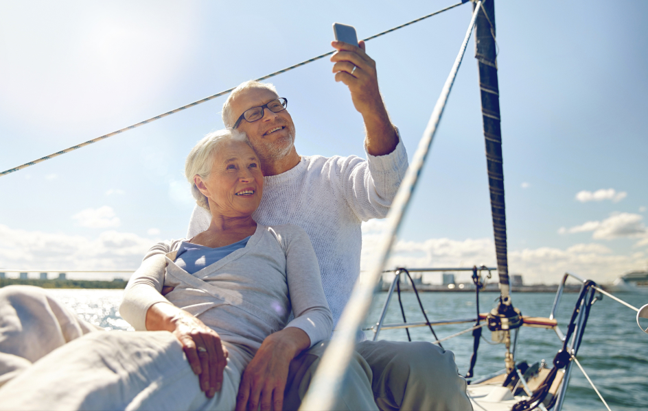 Couple on a yacht taking a selfie