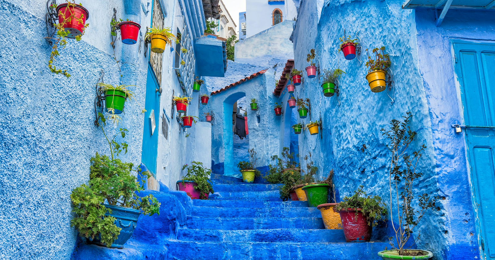 The blue streets of Chefchaouen, Morocco, with whitewashed walls and blue-painted doorways