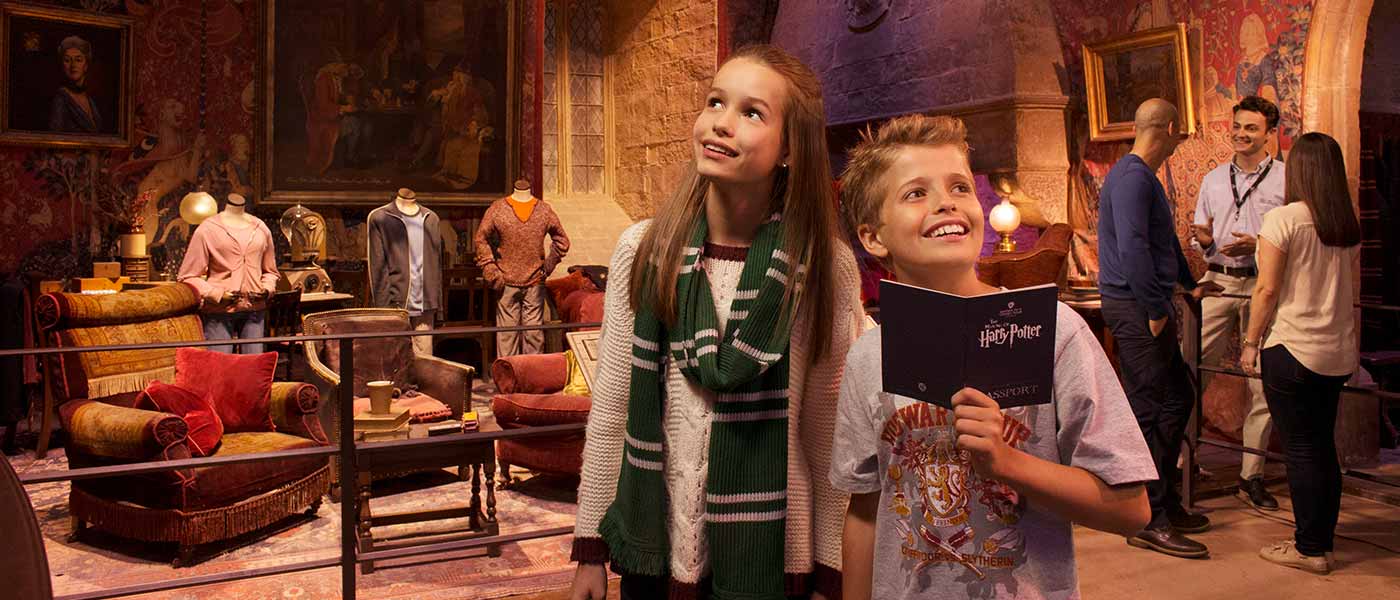 Visitors exploring the Gryffindor Common Room at Warner Bros. Studio Tour.