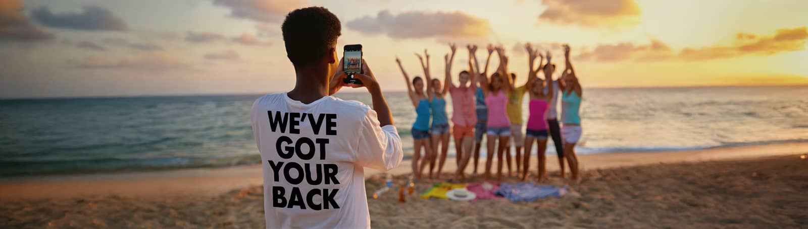 Someone wearing a t-shirt that reads “We’ve got your back”