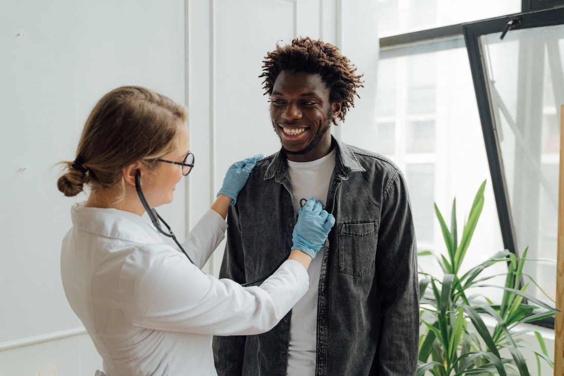 doctor checking the pulse of a patient