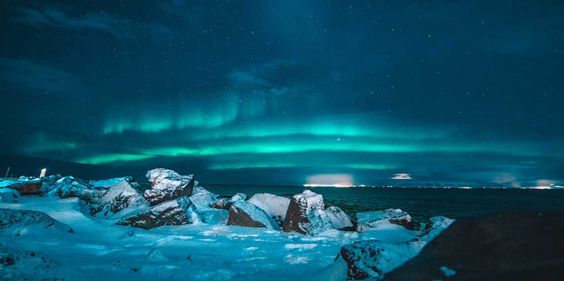scenic view of Iceland with northern lights