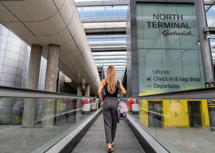 woman walking towards north terminal at gatwick airport