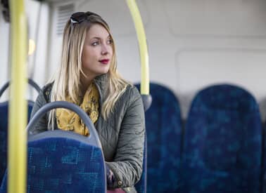 woman sitting on transfer bus