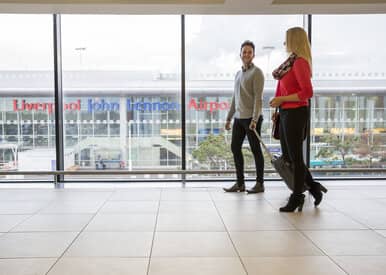 people walking through liverpool airport