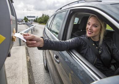 woman using car park ticket at liverpool airport