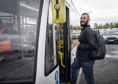 man boarding bus