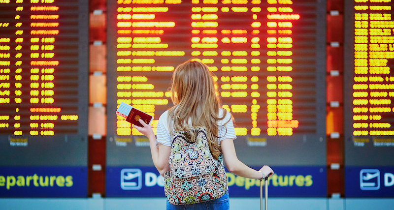 Airport departure board showing flights